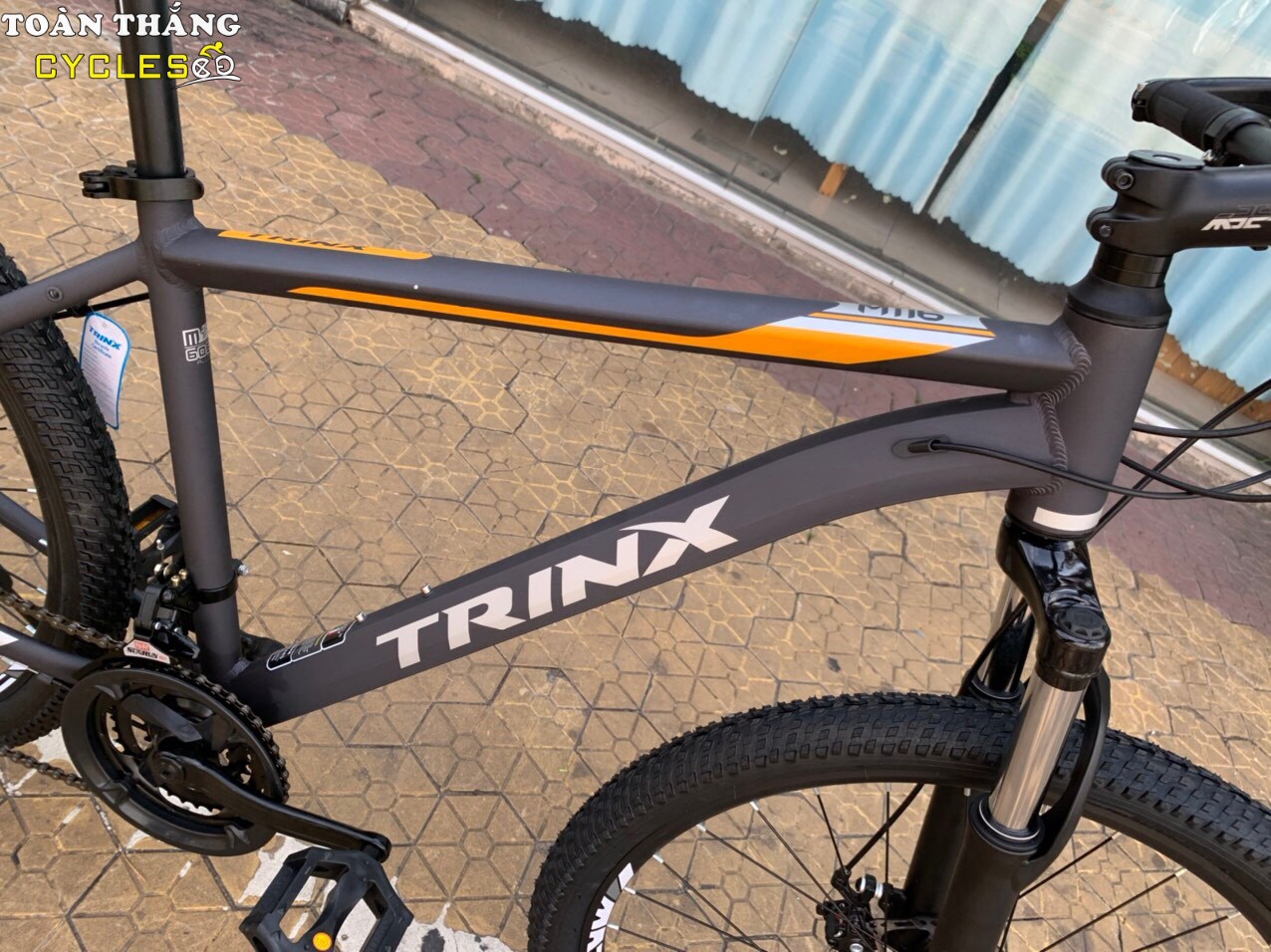 Xe đạp địa hình TrinX M116 2021 Đen cam