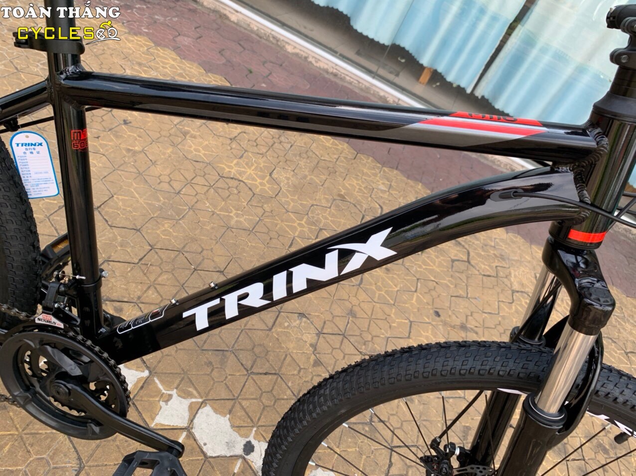 Xe đạp địa hình TrinX M116 2021 Đen đỏ